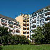 Prinzenpark Ansicht Fassade Wohnhäuser in Pastellfarben vom Park aus betrachtet
