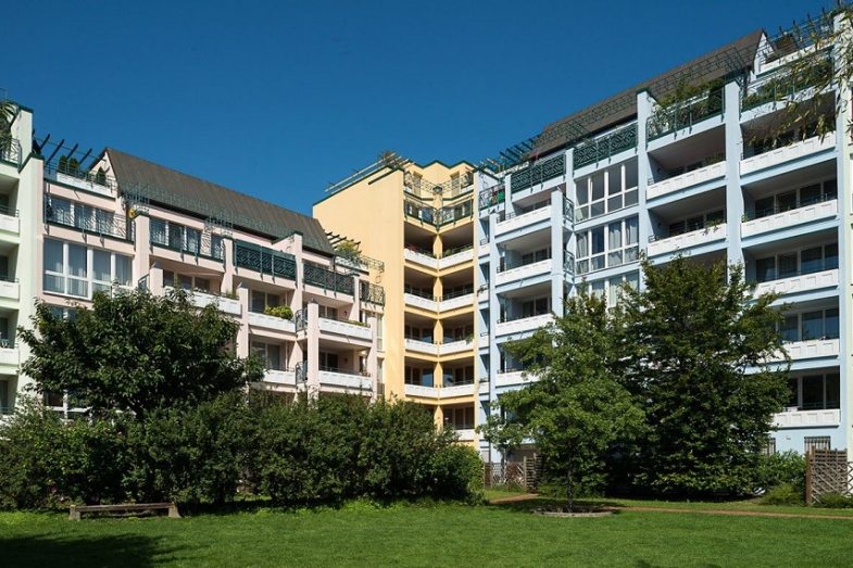 Prinzenpark facades of residential buildings in pastel colors seen from park